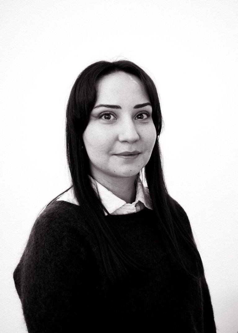 Black/white portrait of Melhia B. Dogan